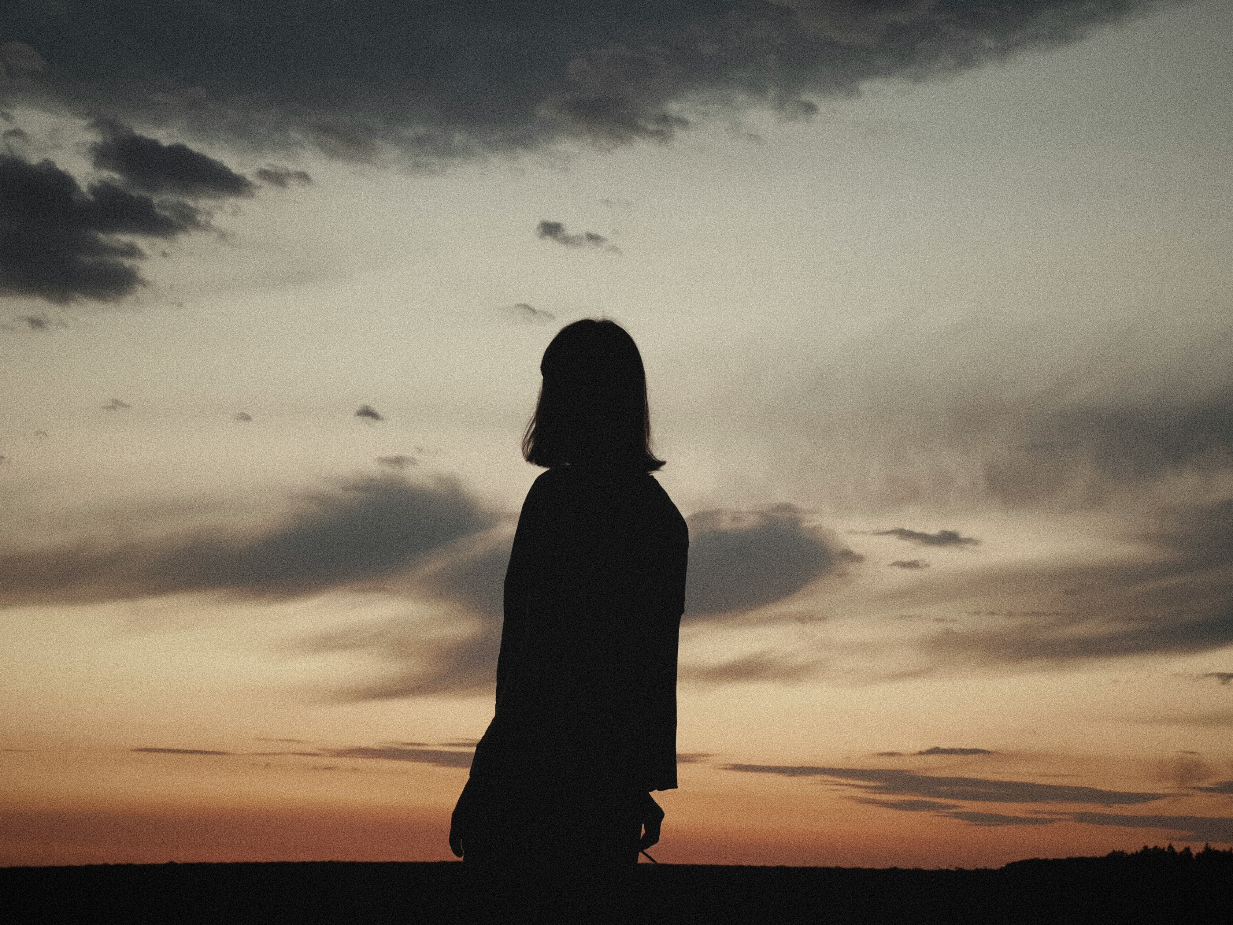  woman looking at the sky at night, depression