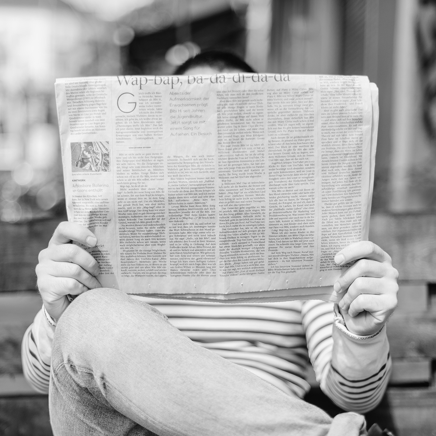  A person reading the newspaper