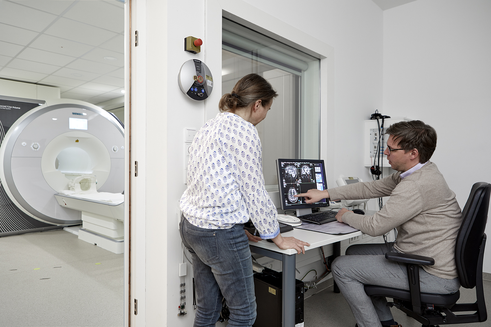 MRT and two researchers looking at results